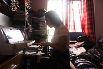 Jiang was answering customers'inquiry in her bedroom, which is also her office and warehouse.